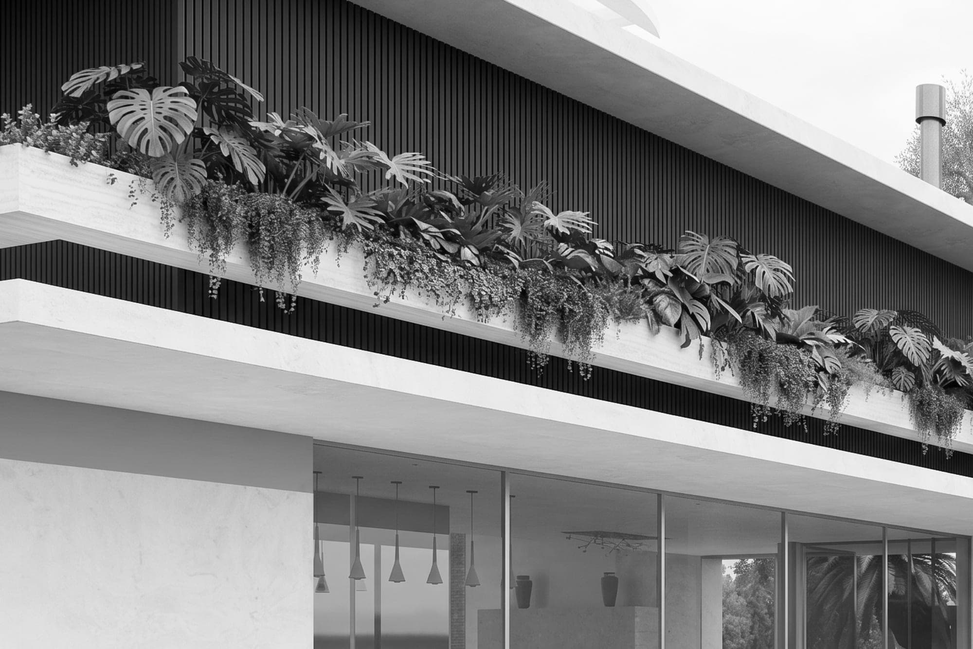 Black-and-white view of the lake facade: a long planted band of monstera and trailing greenery spilling from the upper slab over the glazed living room.