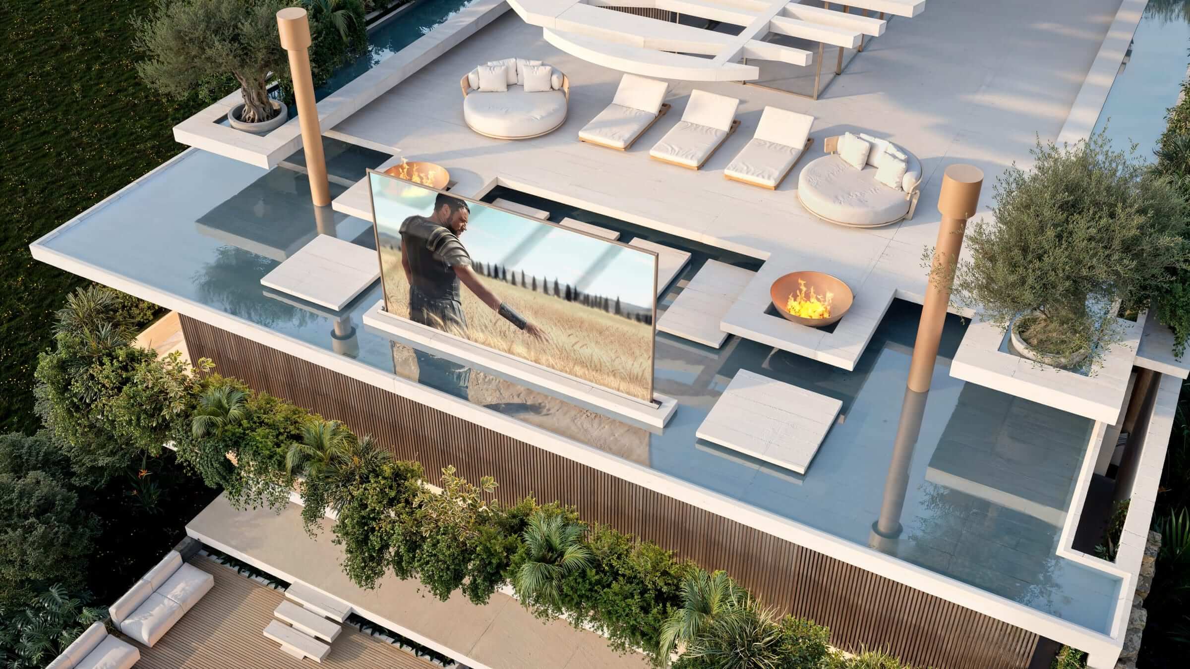 The open-air cinema projected onto a glass screen, between the reflecting pools of the roof.